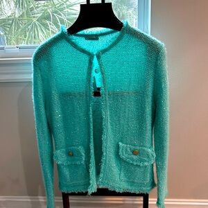 Sparkle in this beautiful turquoise sweater